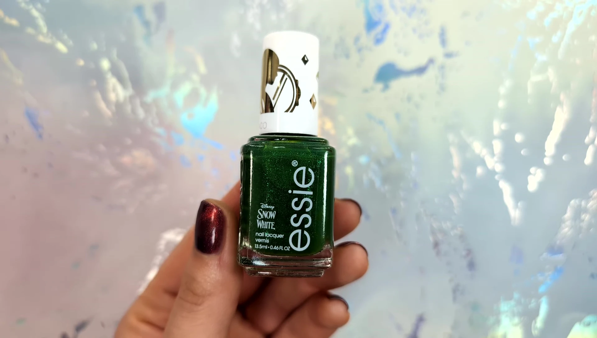 Close-up shot of the deep emerald green nail polish.