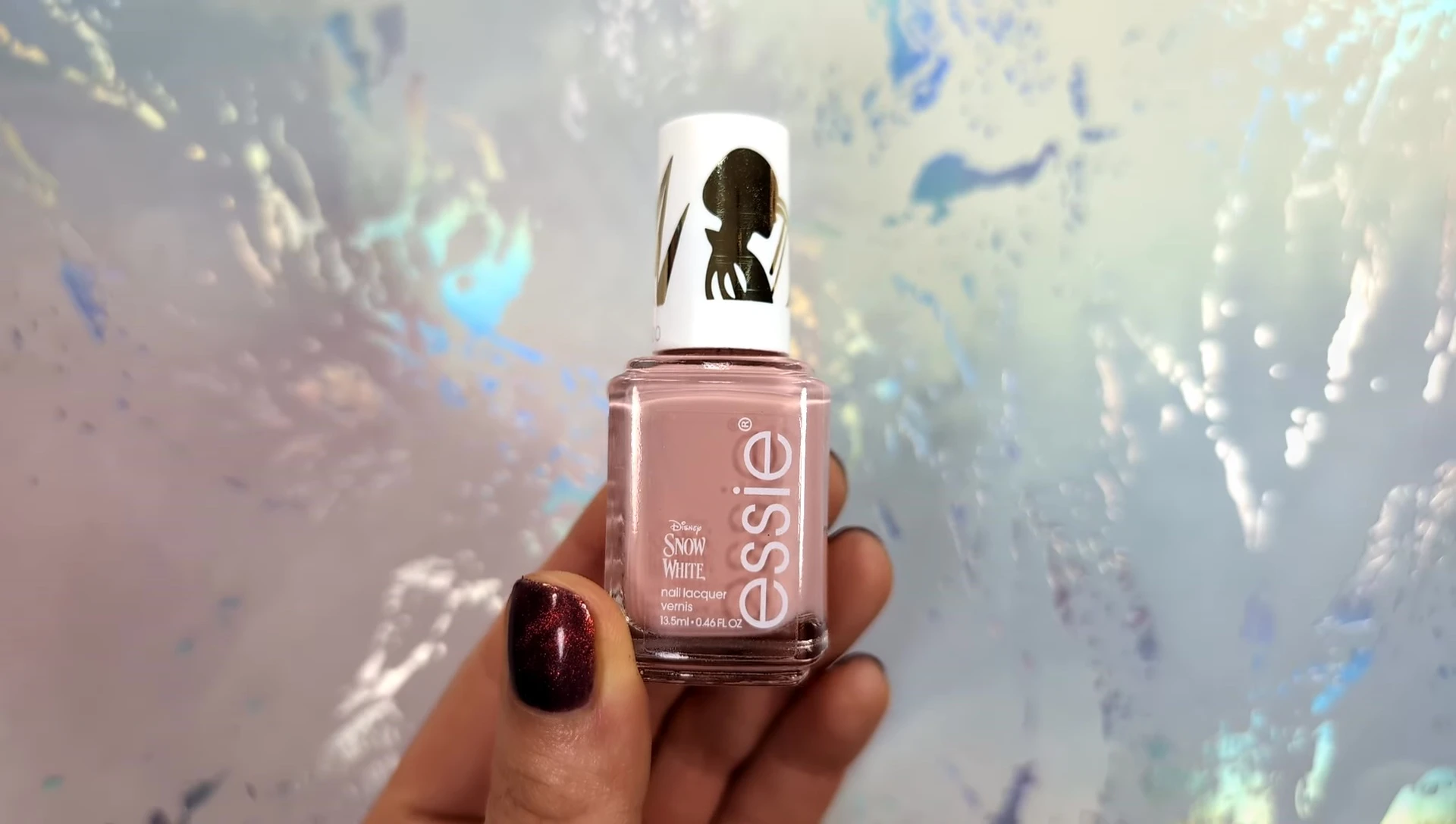 Close-up shot of the dusty pink nail polish.