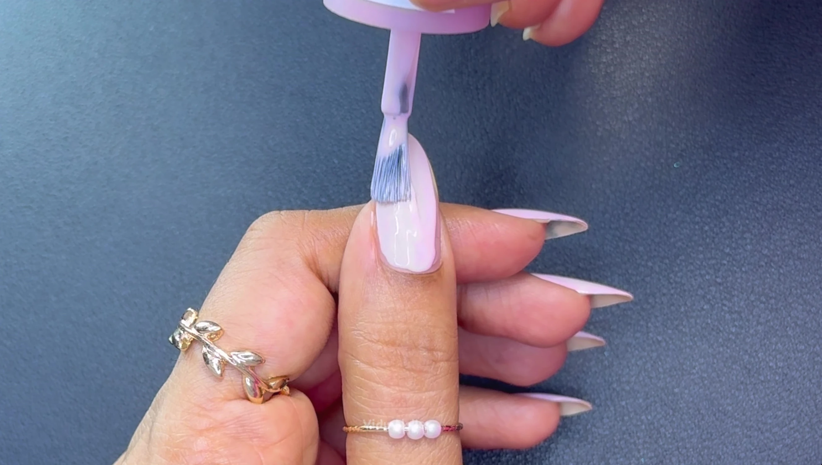 Close-up shot of Lyra pastel pink nail polish