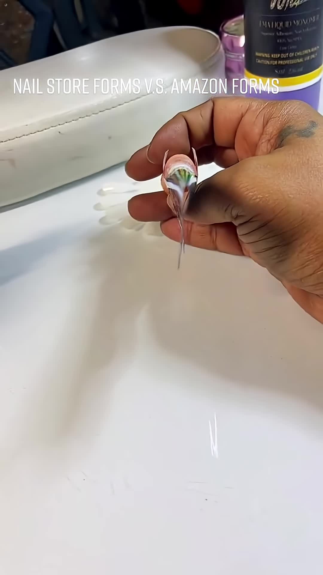 Close-up of the poorly adhering nail form, demonstrating lack of adhesion.