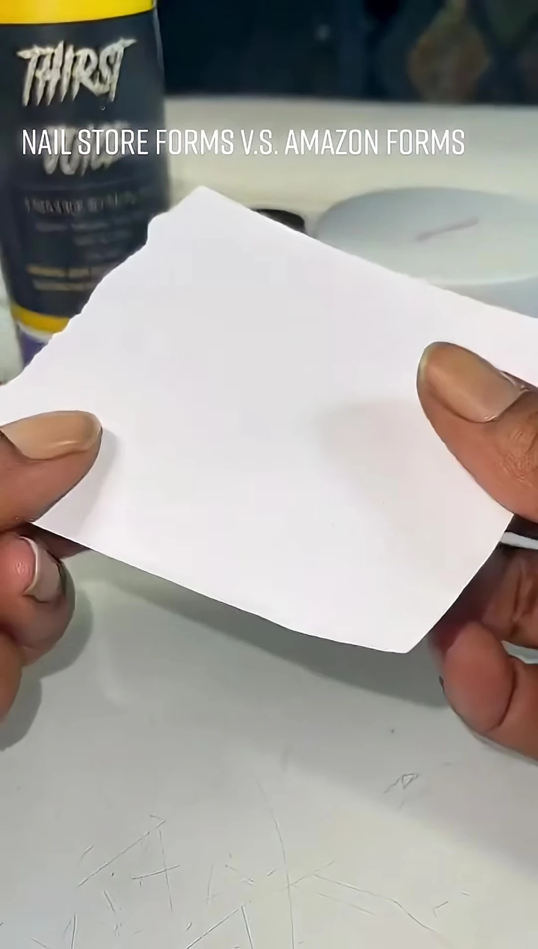 Image depicting the nail forms displayed amongst acrylic supplies, suggesting potential damage or misplacement.