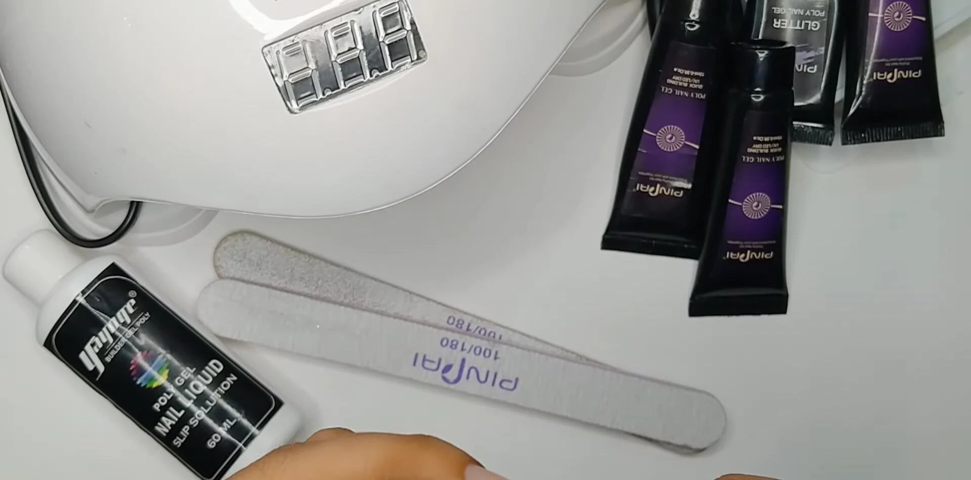 The dual-sided brush being used to apply the polygel.