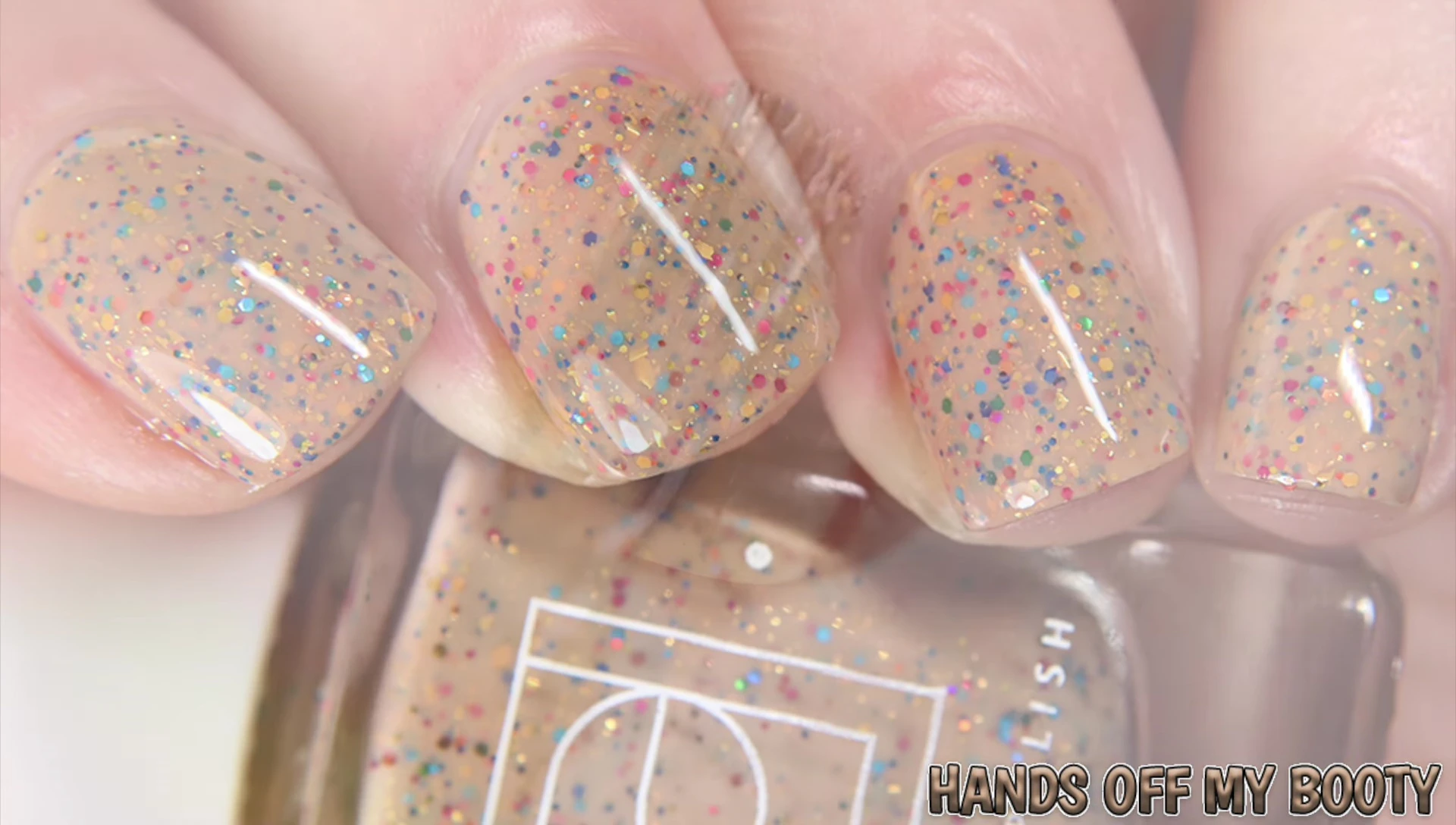 Swatches of Hands Off My Booty under different lighting conditions