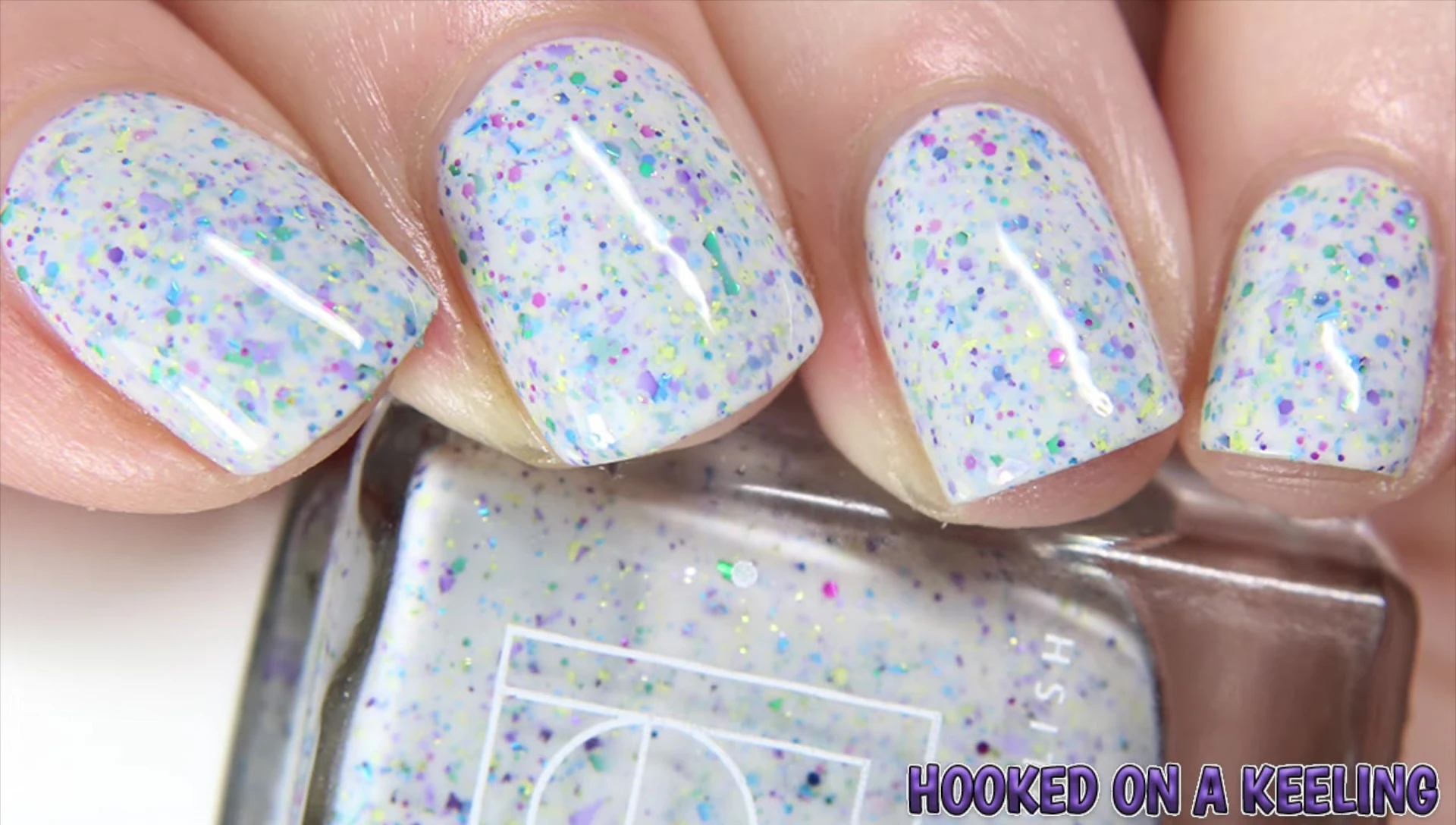 Close-up shot of Hooked on a Kaling nail polish bottle