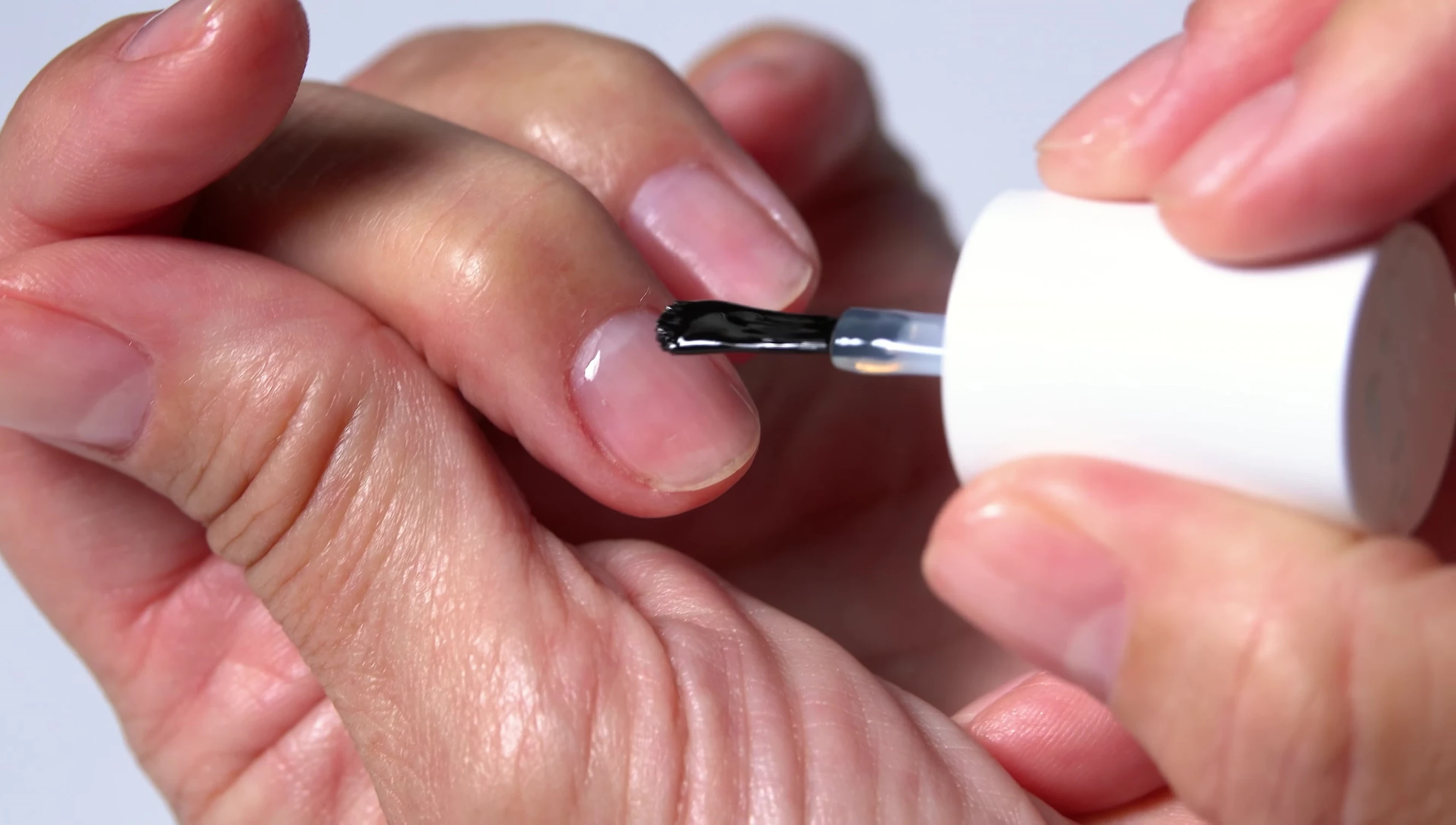 Visual showcasing healthy-looking nails after product use.