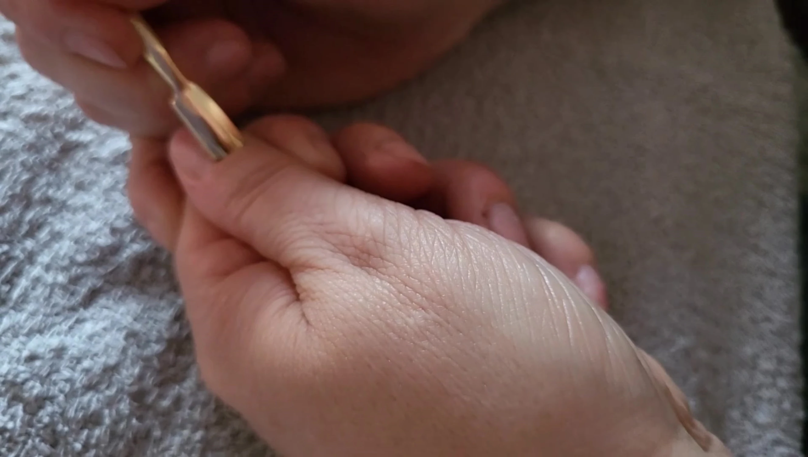 The reviewer using the cuticle pusher.