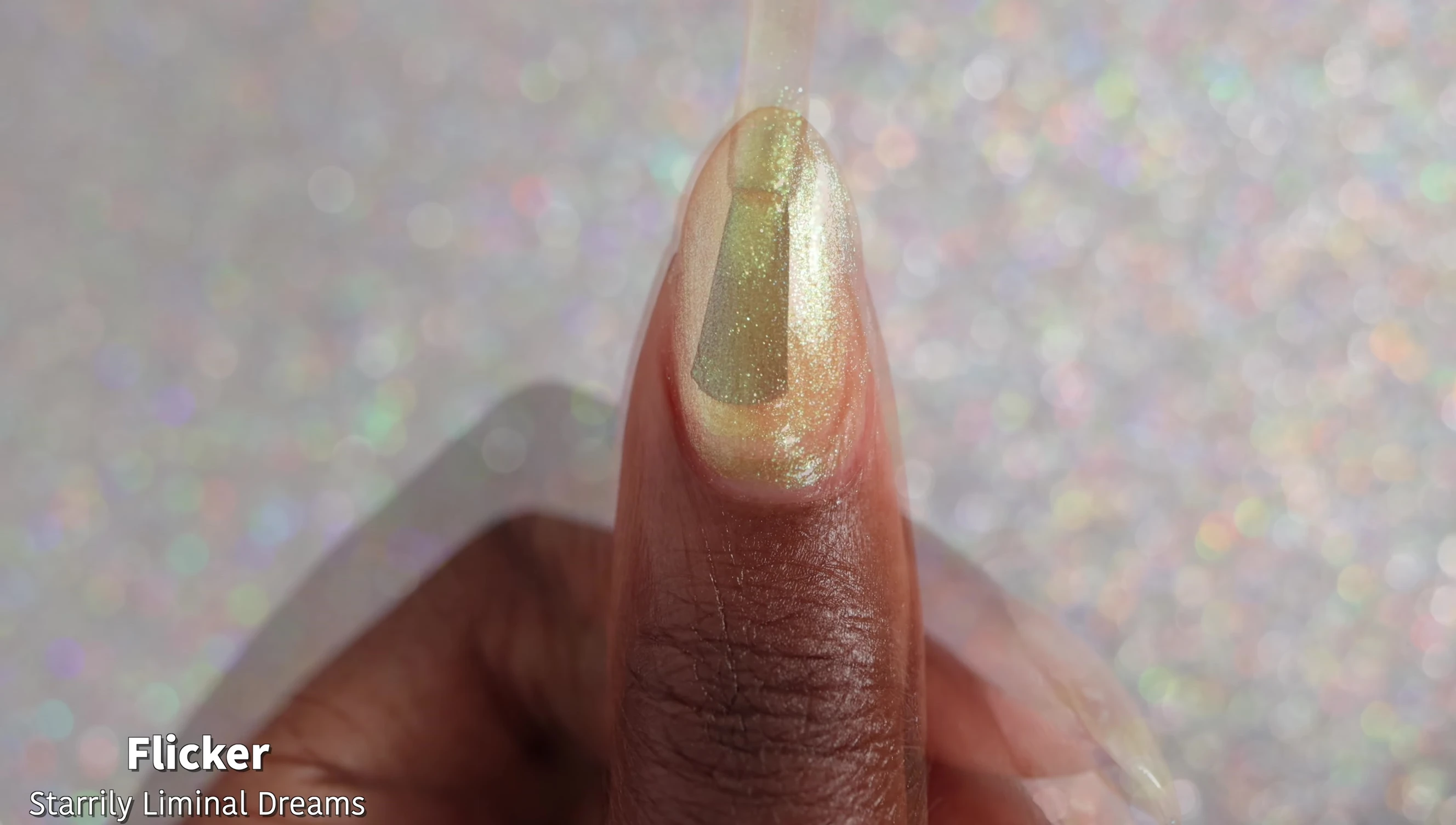 Swatches of Flicker on nails showing the color shift