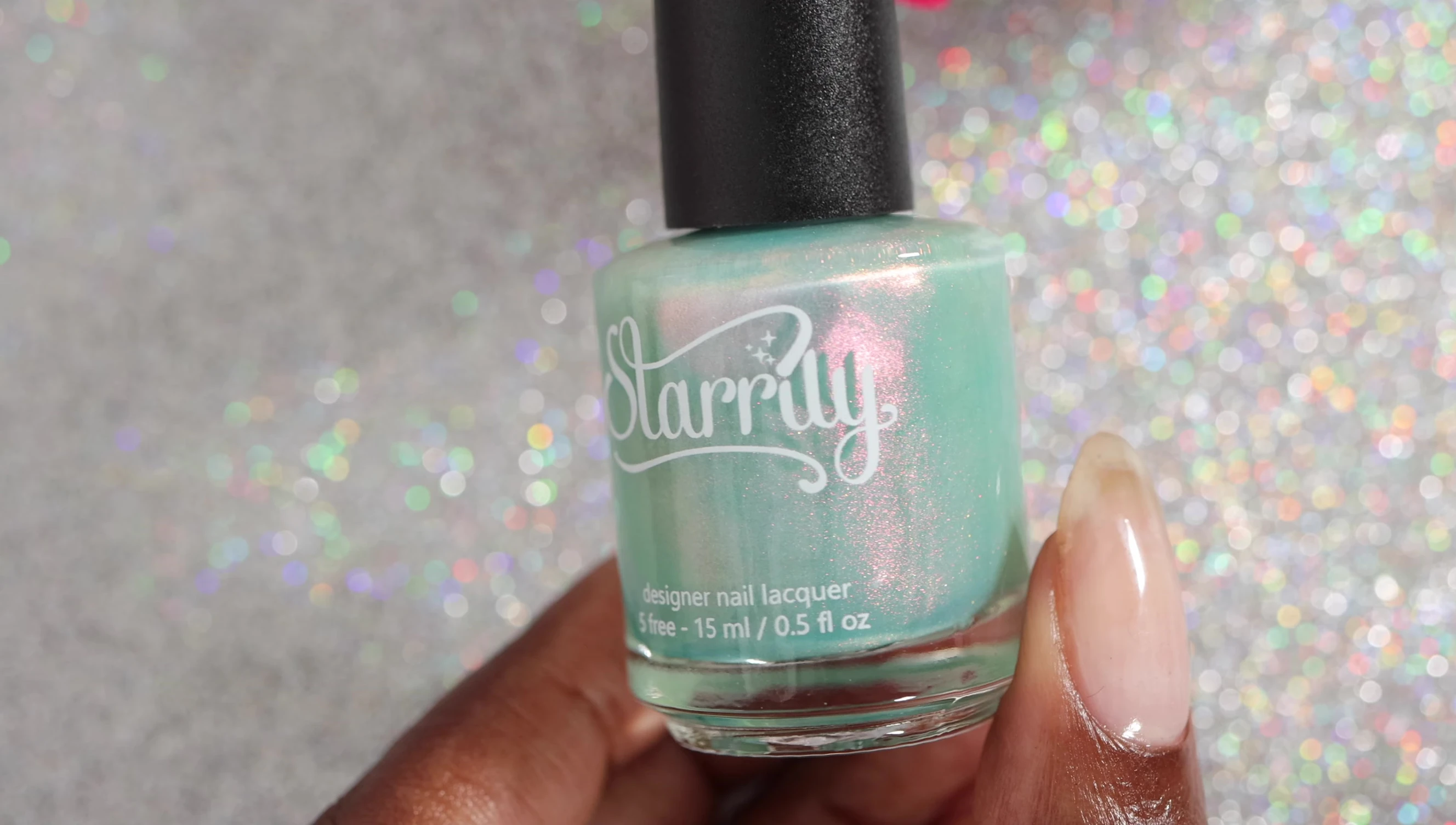 Persistent Realm nail polish bottle