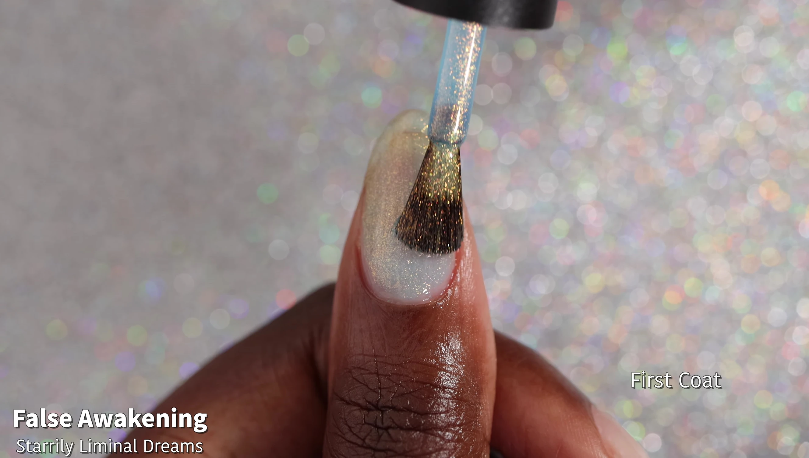 Swatches of False Awakening on nails, showcasing the shimmer