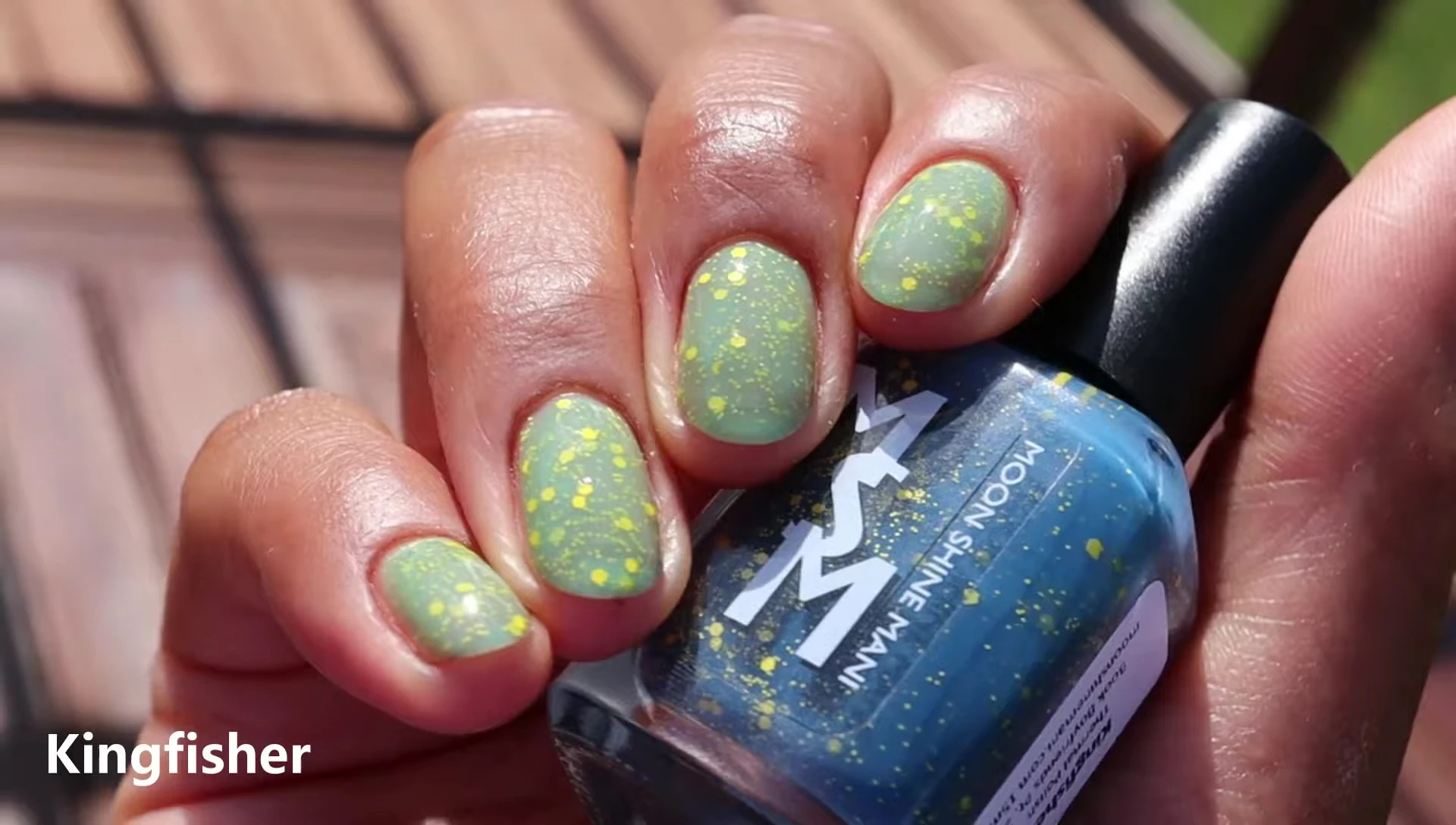 Kingfisher polish on nails in three coats, showing the color transformation