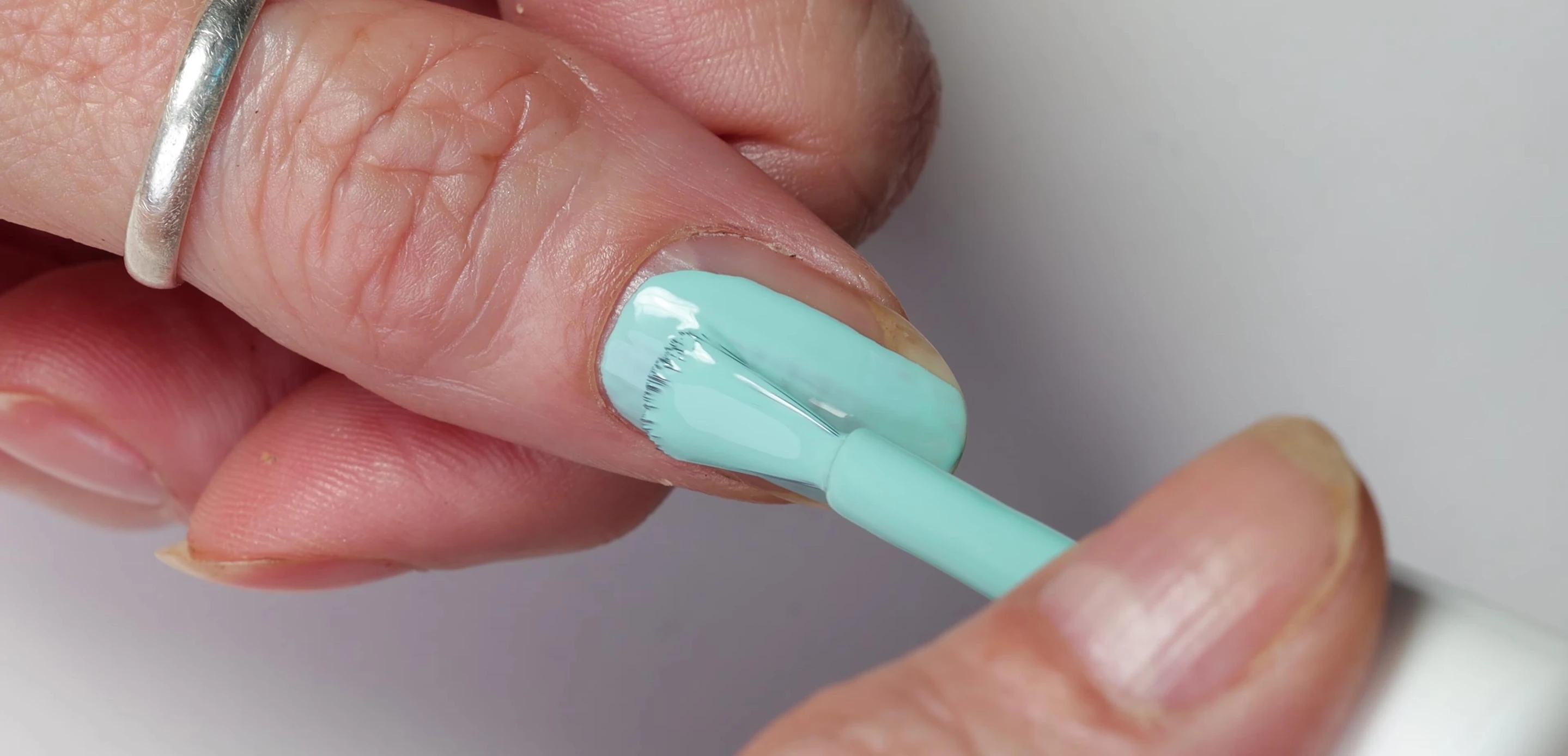 Close-up of Capri nail polish bottle and swatch