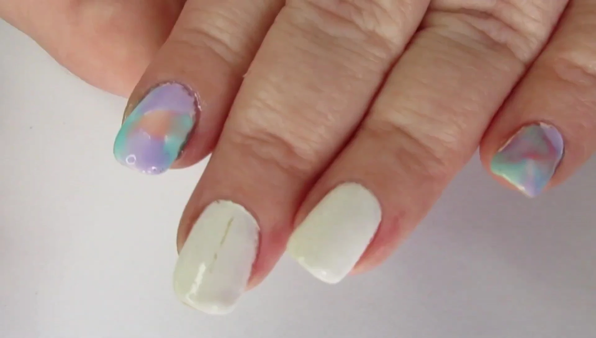 Example of a simple nail art design created with the watercolor top coats.