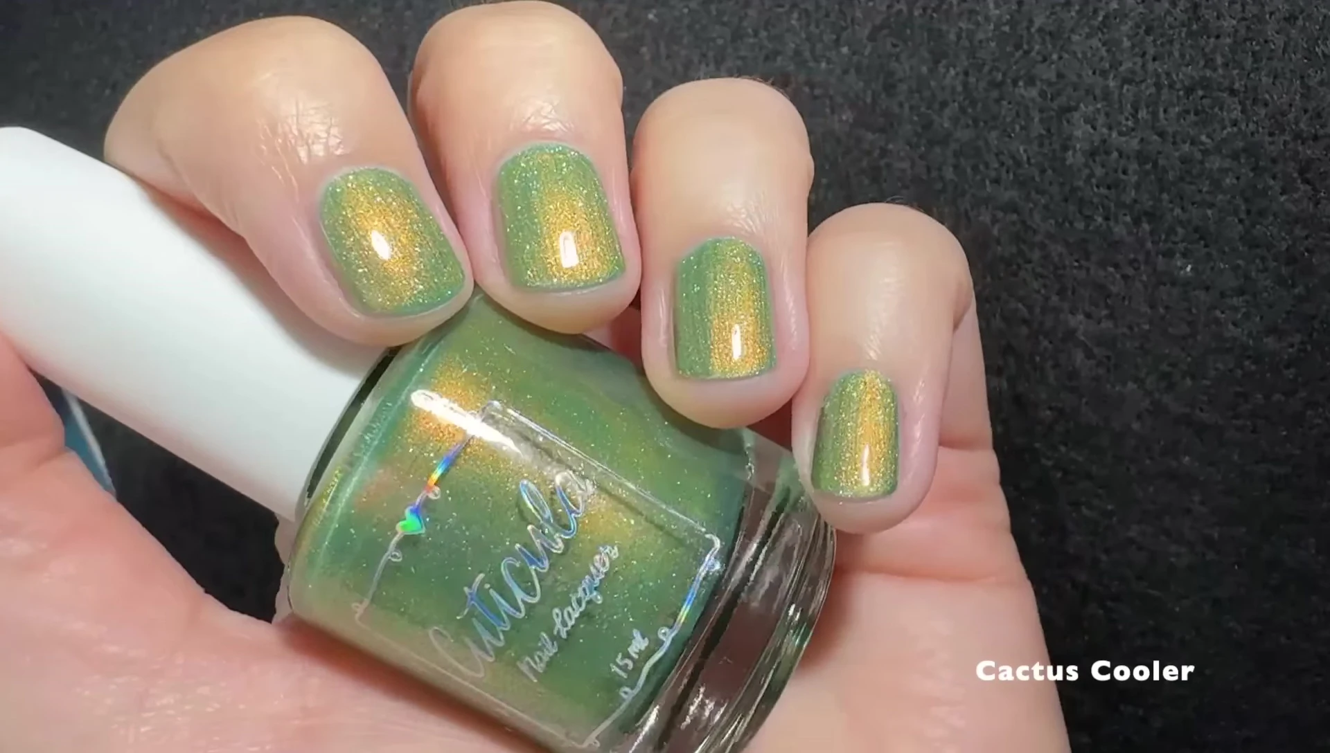 Cactus Cooler nail polish on a hand with top coat
