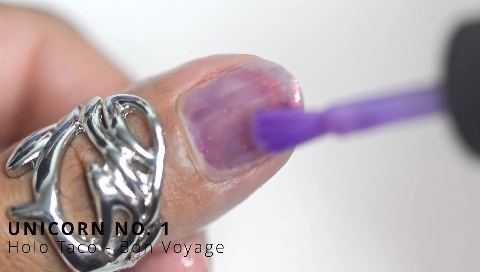 Close up of the Unicorn Number One polish applied to nails