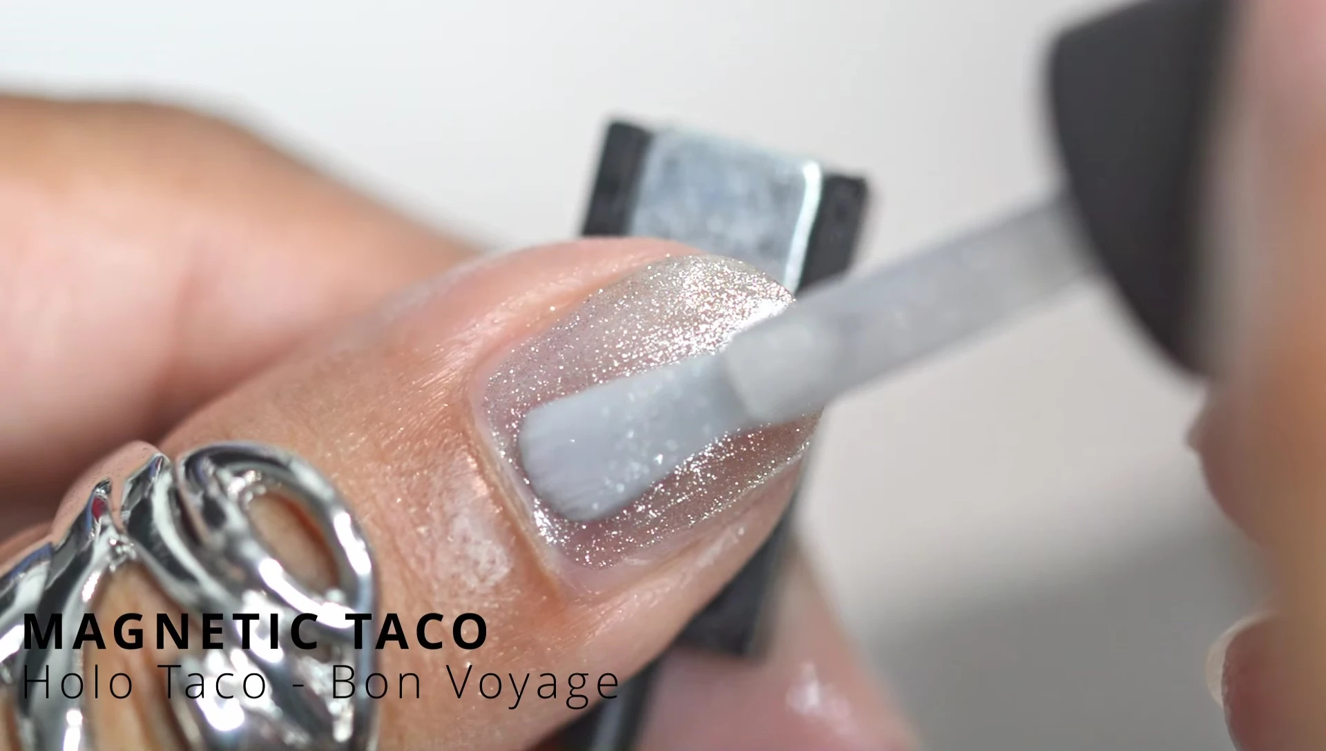 Hand model showcasing the Magnetic Taco polish on nails