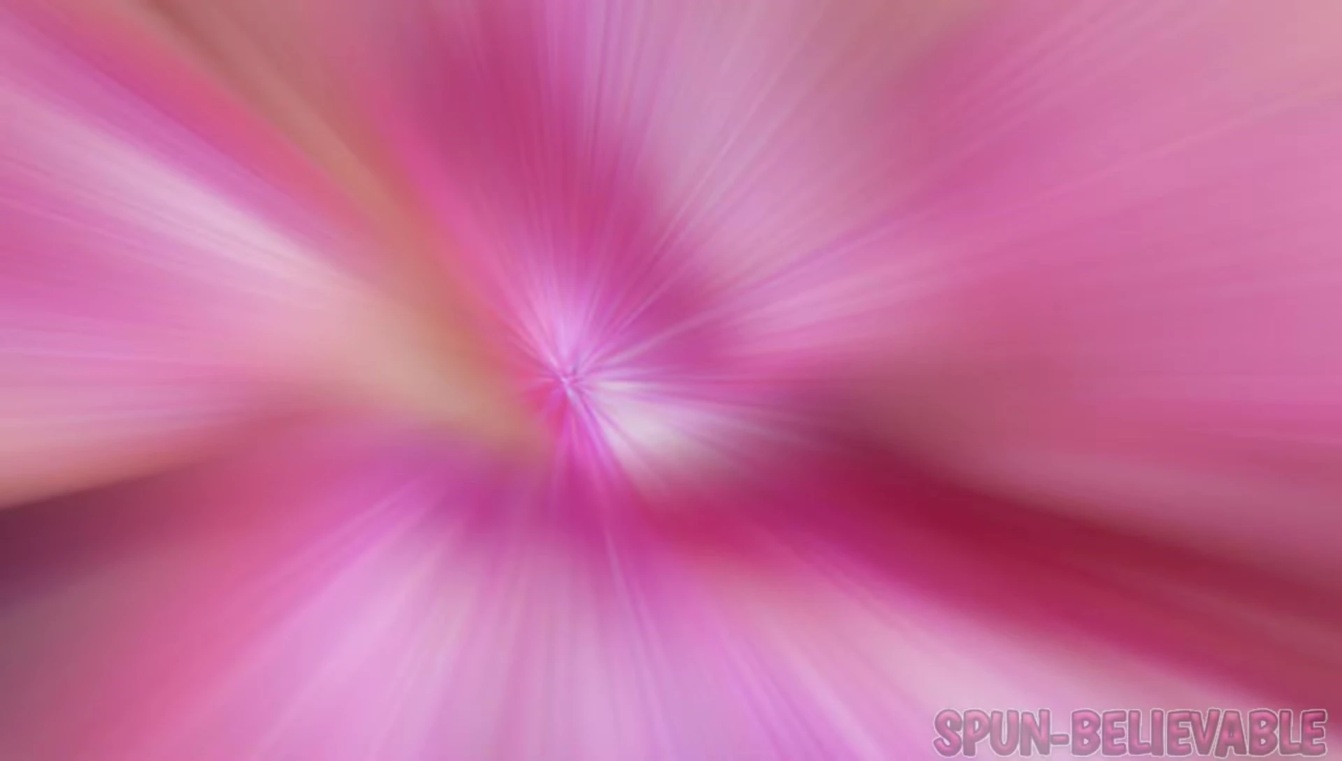 Close-up swatch of Spunbelievable under natural light, highlighting its pink base and color shifts.