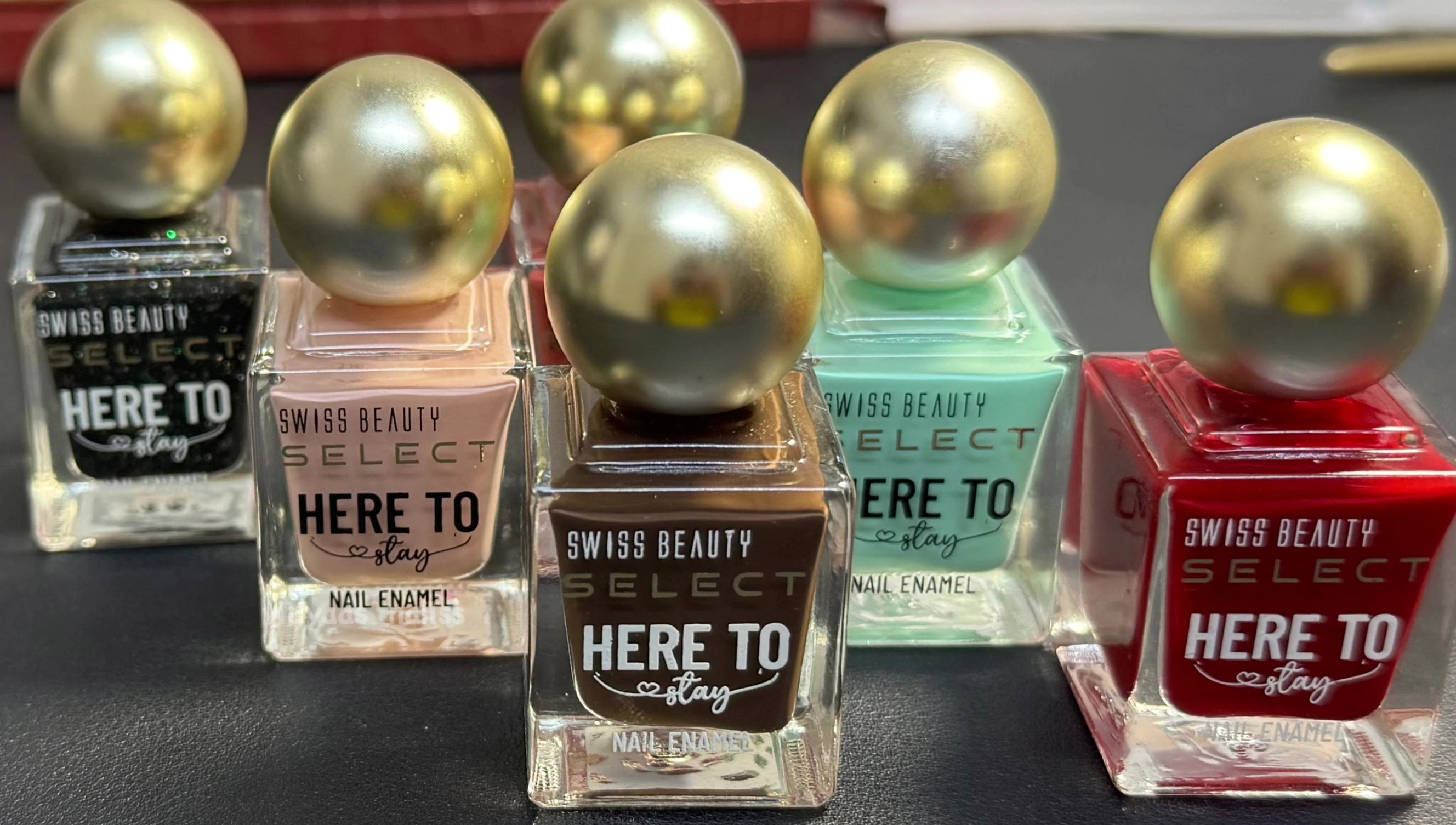 A shot showing all six nail polish bottles together.