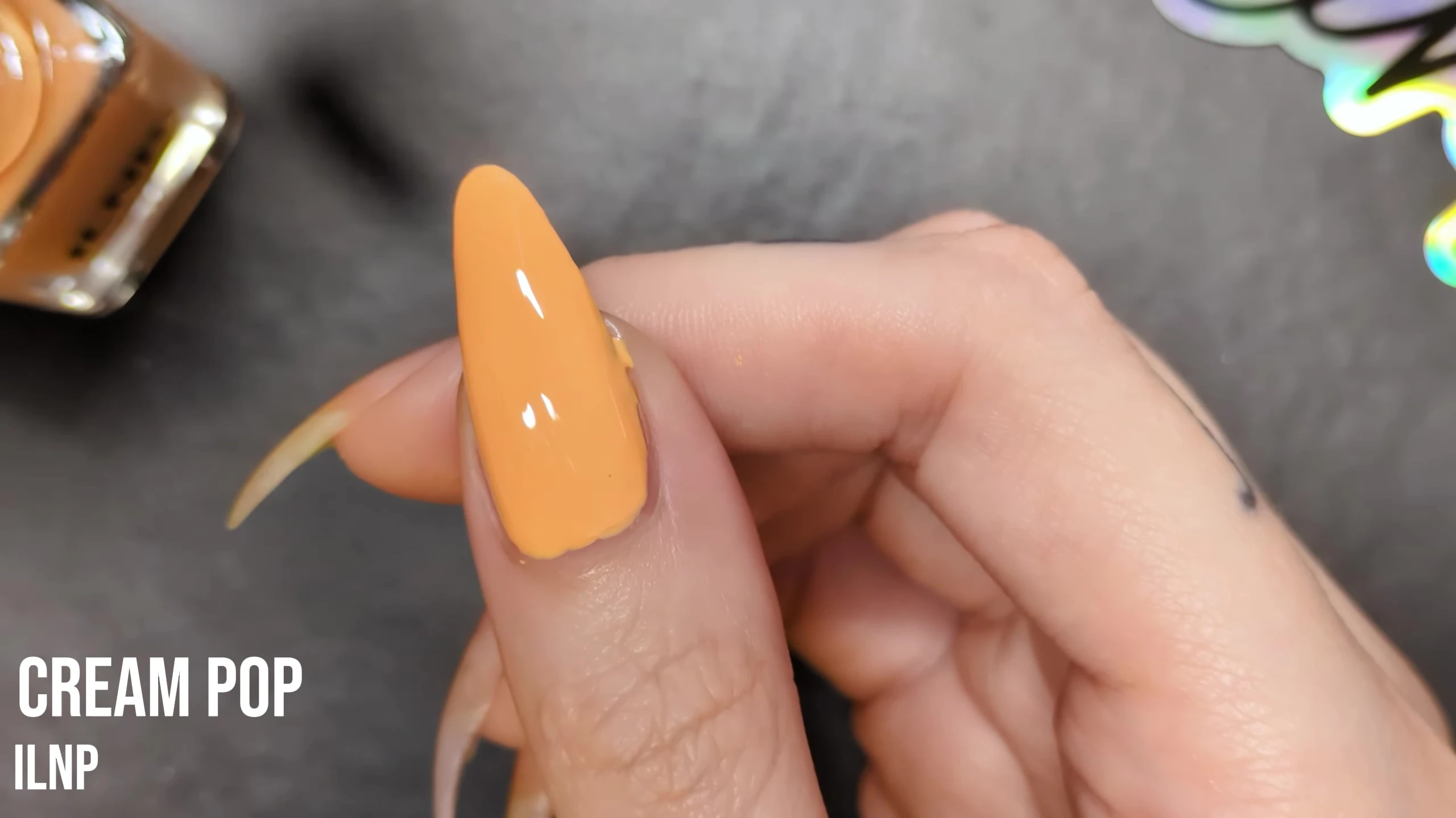 Final result of Cream Pop nail polish on the model's nail