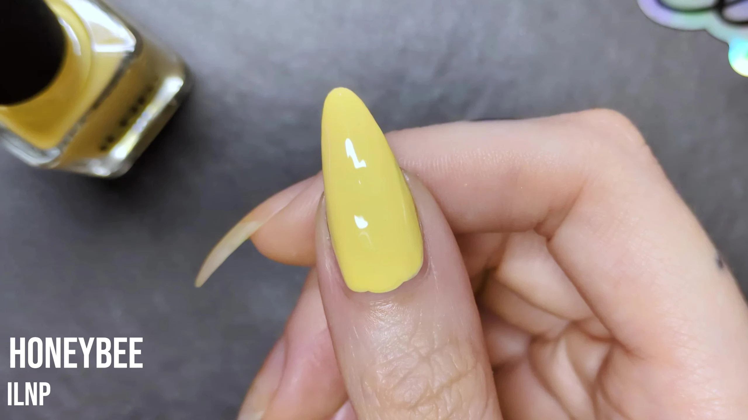 Final result of Honeybee nail polish on the model's nail
