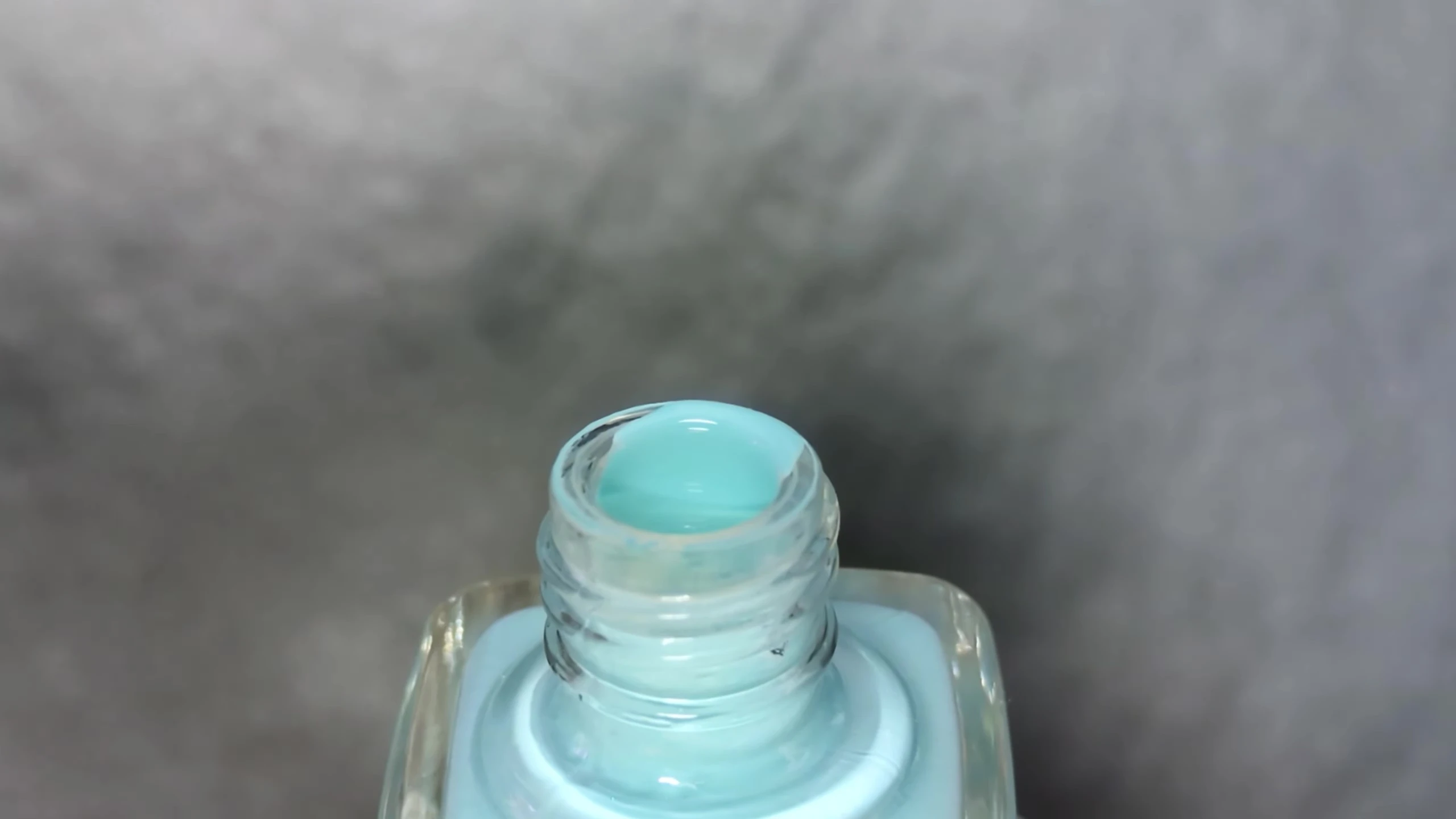 Close-up of Oasis nail polish on the model's nail
