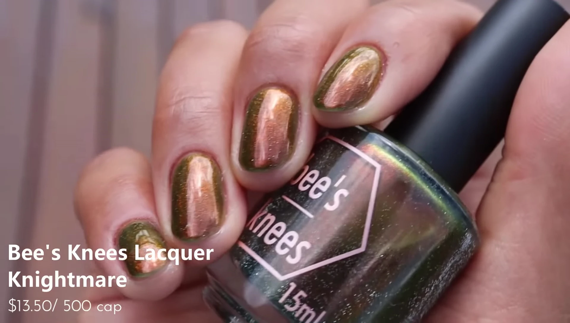 Hand swatch of Nightmare in three coats with glitter smoother and glossy top coat.