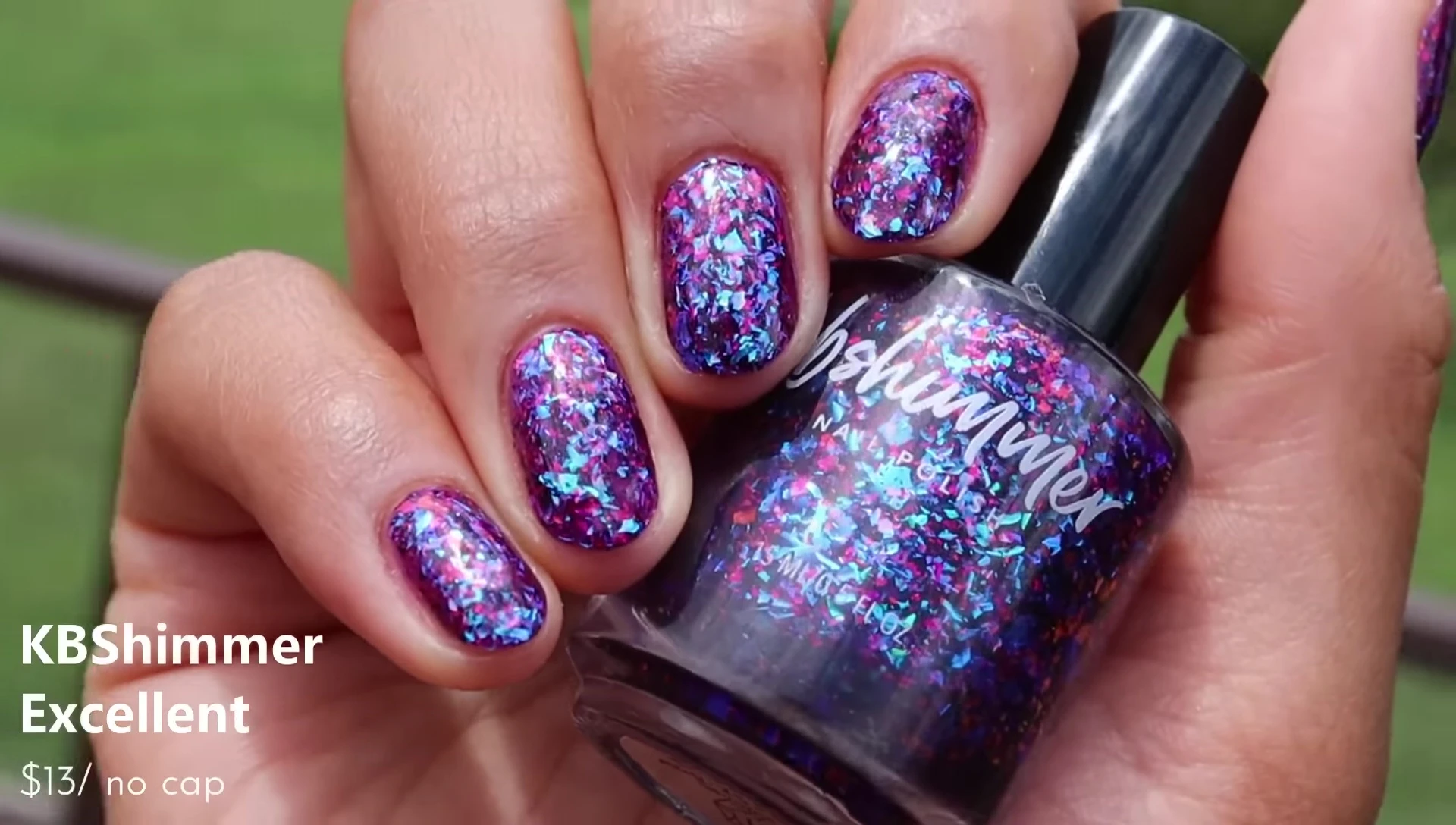 Hand swatch of Excellent in three coats with glitter smoother and glossy top coat.